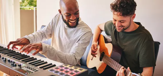 Two men plays instruments
