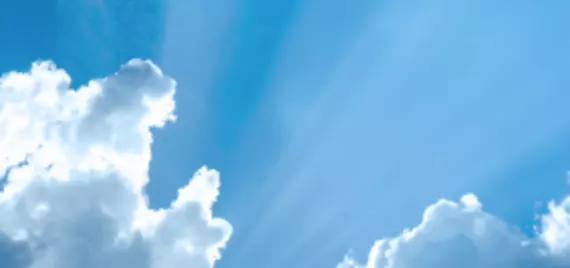 Sun peaking out from behind clouds 