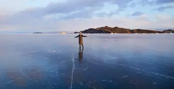 person standing on a frozen lake