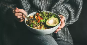 woman holding a salad