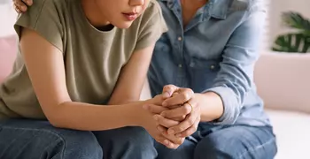 woman being comforted