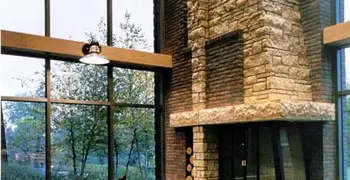 a seating area with a large fireplace