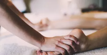 Acupressure being performed on feet