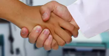 patient shaking hands with doctor