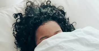Person reluctant to get out of bed.