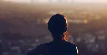 person looking over large city from above