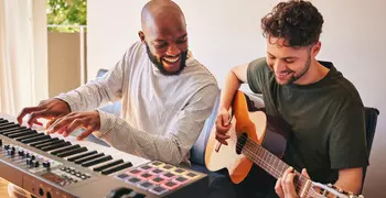 Two men plays instruments
