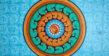 an image of a blue, green and orange mandala