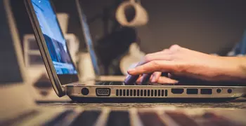 Person communicating by typing on computer