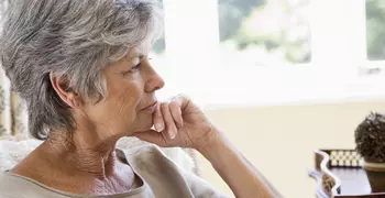 woman looking out a window