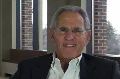 Jon Kabat-Zinn smiling at the camera