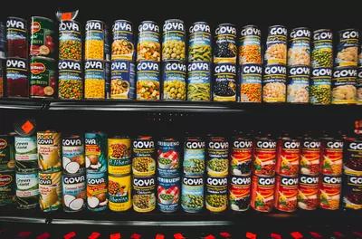 rows of canned foods at a grocery store