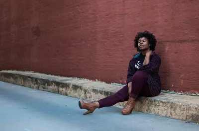 woman sitting outside with eyes closed