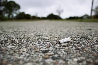 cigarette butt lying on ground outside