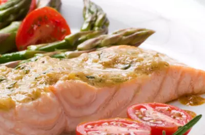 Salmon, tomatoes, and asparagus on a plate