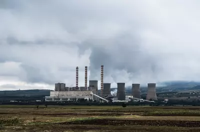 clouds from smokestacks polluting the air