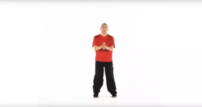 Man practicing standing Tai Chi.