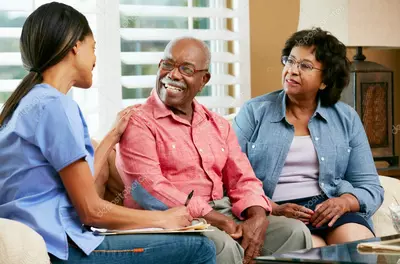 Nurse talking with middle age couple