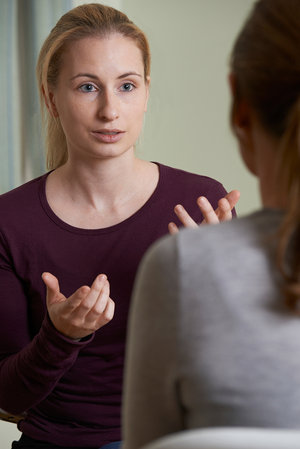 woman talking to a healthcare provider