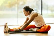 woman stretching on mat