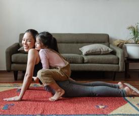 mother and child doing yoga