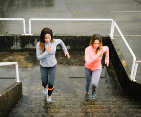 Two woman climbing stairs