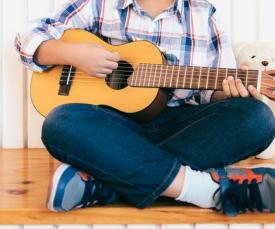 Child playing guitar