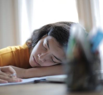 woman sleeping on desk