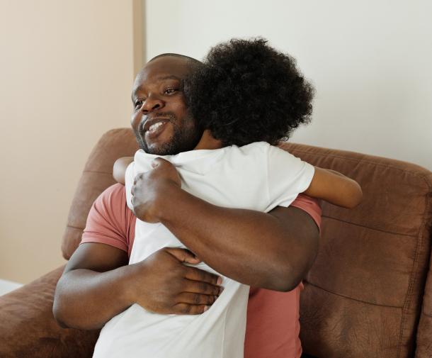 dad hugging son