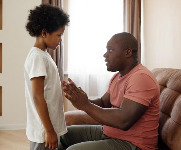 father talking to son