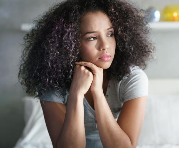 young woman looking sad